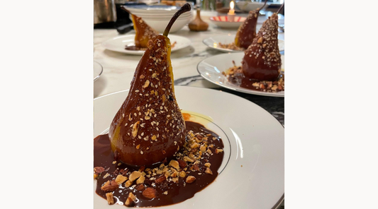 Pears poached in Saffron with Chocolate Sauce and an Almond and Cacao Crunch